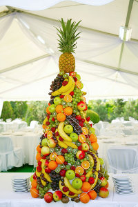 Party Marquee with Fruit Display on Table in Pyramid Shape Party Marquee with Fruit Display on Table in Pyramid Shape