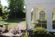 Path leading past garden marquee