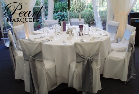 White Chair Covers and Silver Chair Sashes
